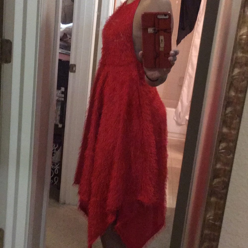 Red backless dress with adjustable neck tie.